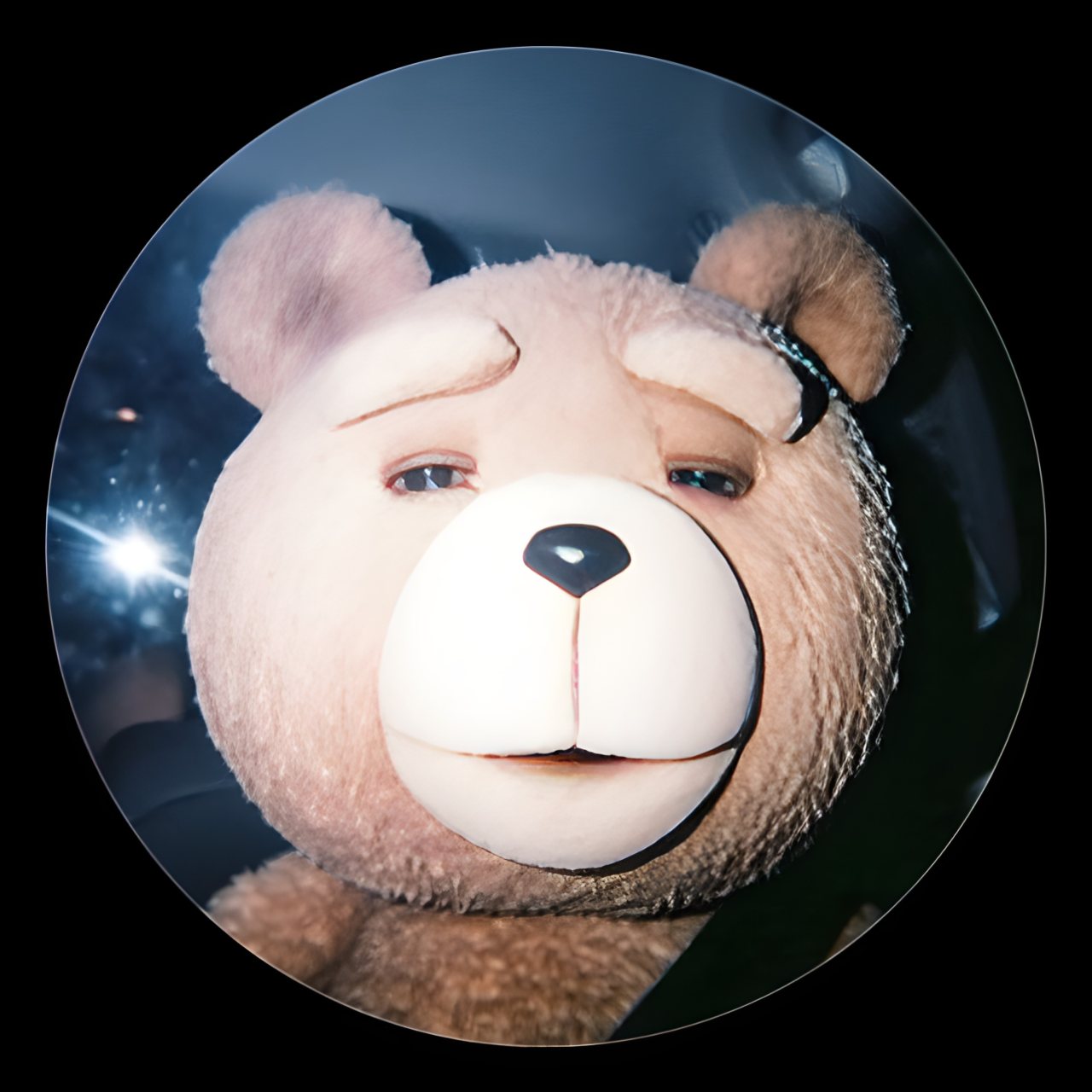 Close-up portrait of a soft teddy bear with pink and brown fur, a large cream muzzle, and a friendly expression inside a dark circular frame.