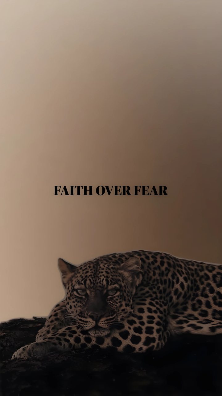 A resting leopard appears against a warm brown background beneath the clearly legible text “FAITH OVER FEAR.”