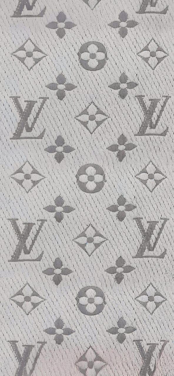 Soft grey woven texture featuring a repeating Louis Vuitton monogram pattern with floral motifs and LV symbols.