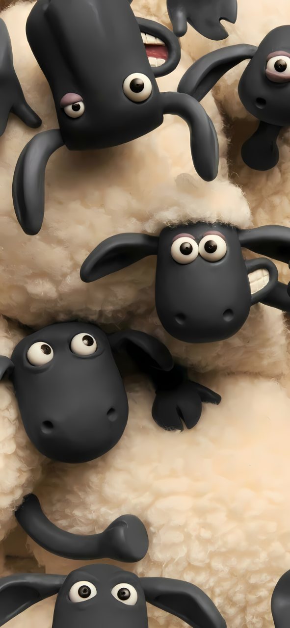 Playful black cartoon sheep with wide eyes lie together on soft cream-colored wool.
